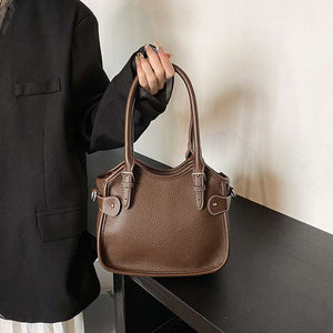 All-match PU leather handbag with adjustable strap and structured shape for travel and casual wear