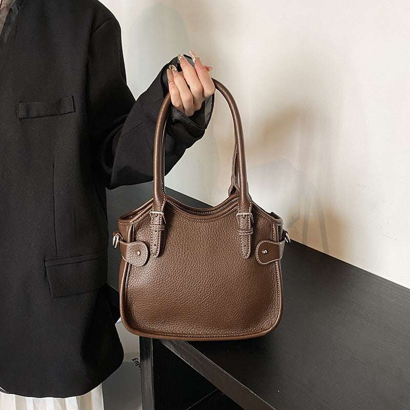 All-match PU leather handbag with adjustable strap and structured shape for travel and casual wear