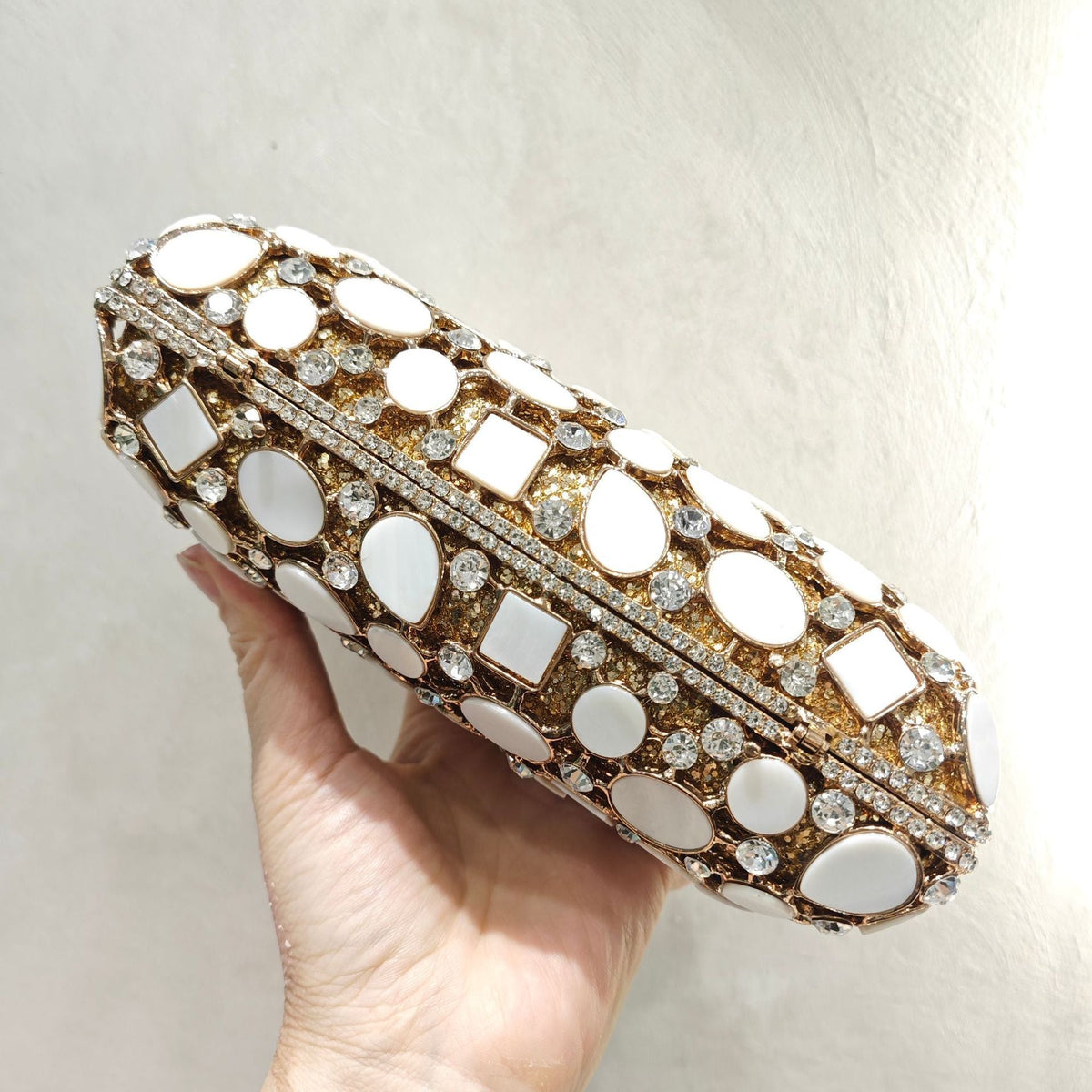 Gold shell clutch handbag embellished with full diamond crystal detailing