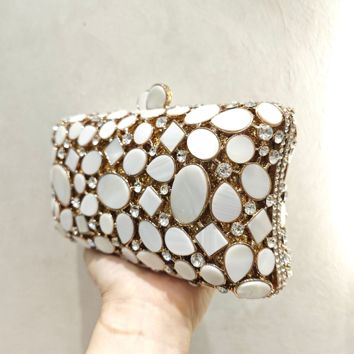 Gold shell clutch handbag embellished with full diamond crystal detailing