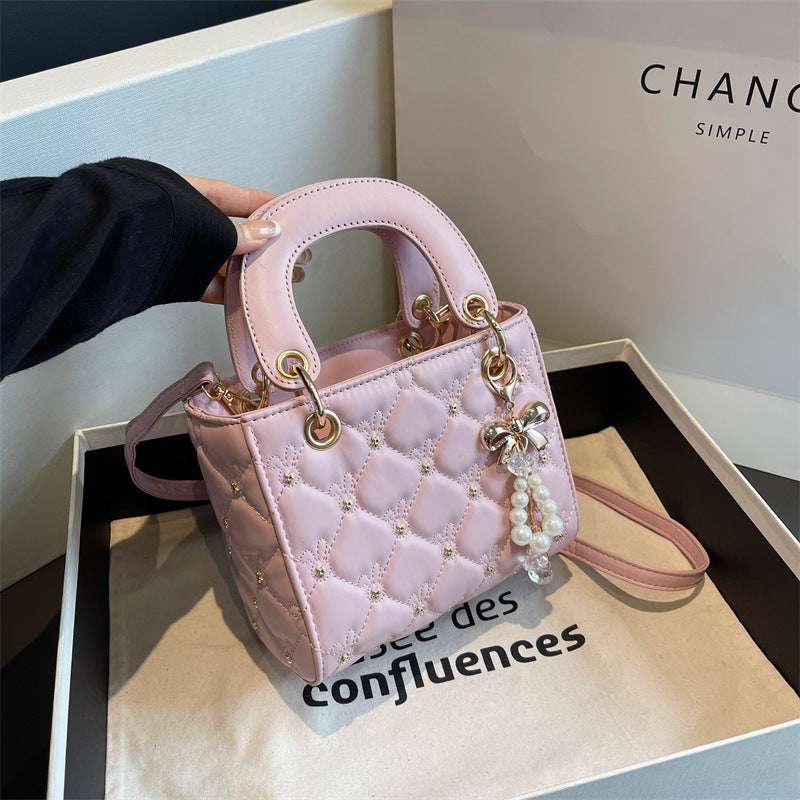 Stylish diamond embroidery polyester shoulder bag featuring intricate threadwork and a chic lightweight design