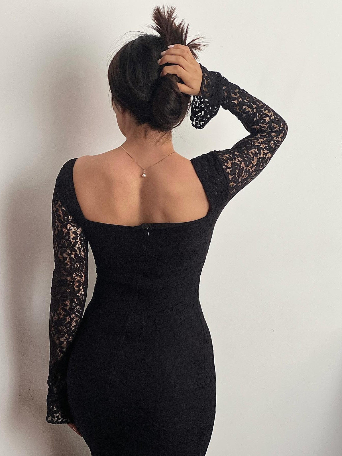 Stylish black square neck bodycon dress with elegant lace panels for parties and nights out