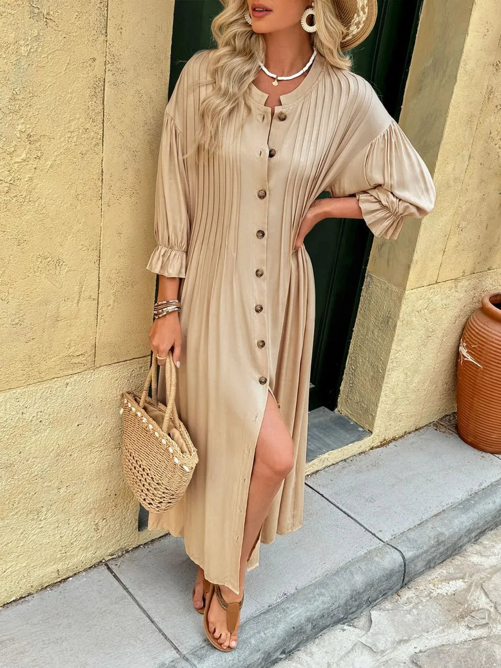 Elegant beige button-front maxi dress with long sleeves and flowing silhouette.