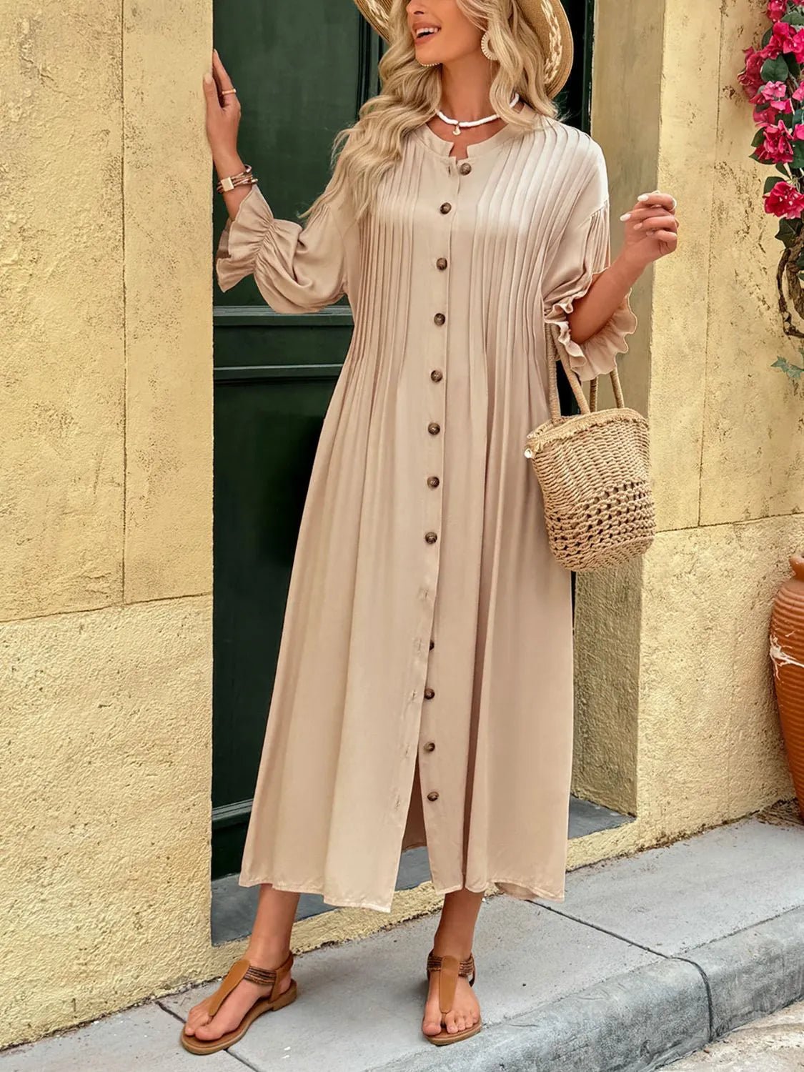 Elegant beige button-front maxi dress with long sleeves and flowing silhouette.