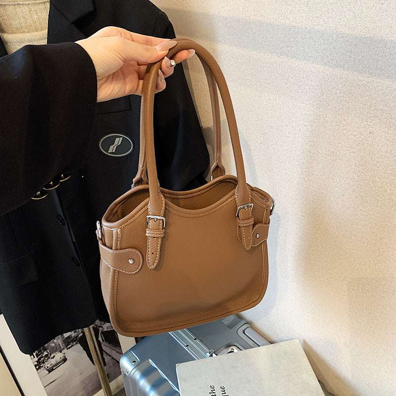 All-match PU leather handbag with adjustable strap and structured shape for travel and casual wear