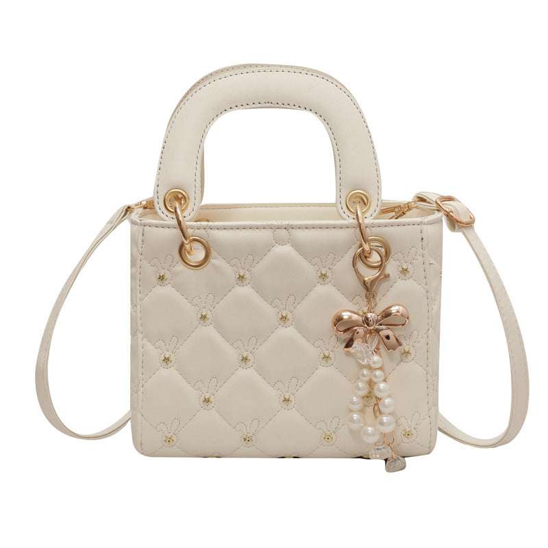 Stylish diamond embroidery polyester shoulder bag featuring intricate threadwork and a chic lightweight design