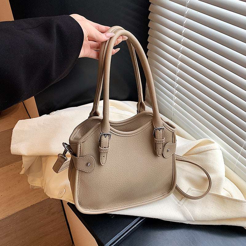 All-match PU leather handbag with adjustable strap and structured shape for travel and casual wear