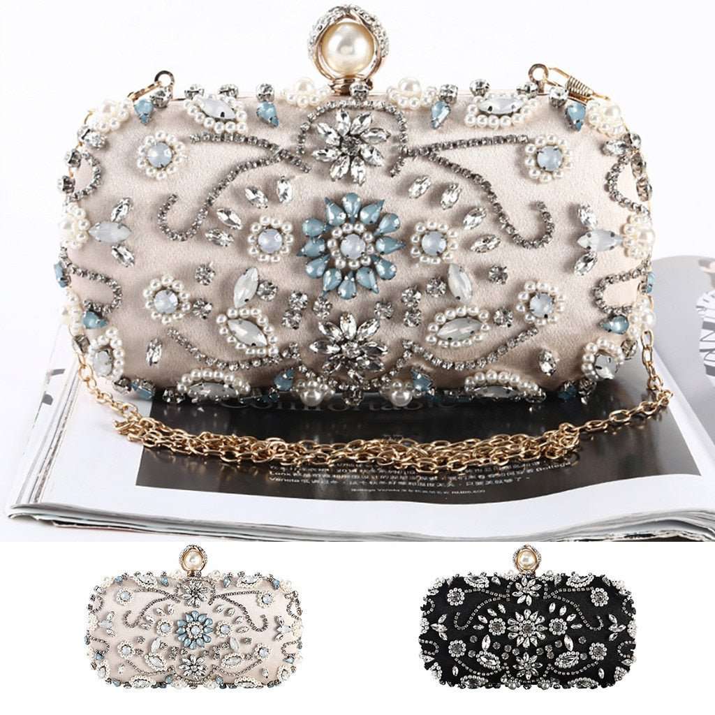 Designer metal clutch bridal chain bag in elegant gold finish with structured silhouette, polished metallic surface, and detachable chain strap, perfect for weddings, evening parties, and formal occasions.