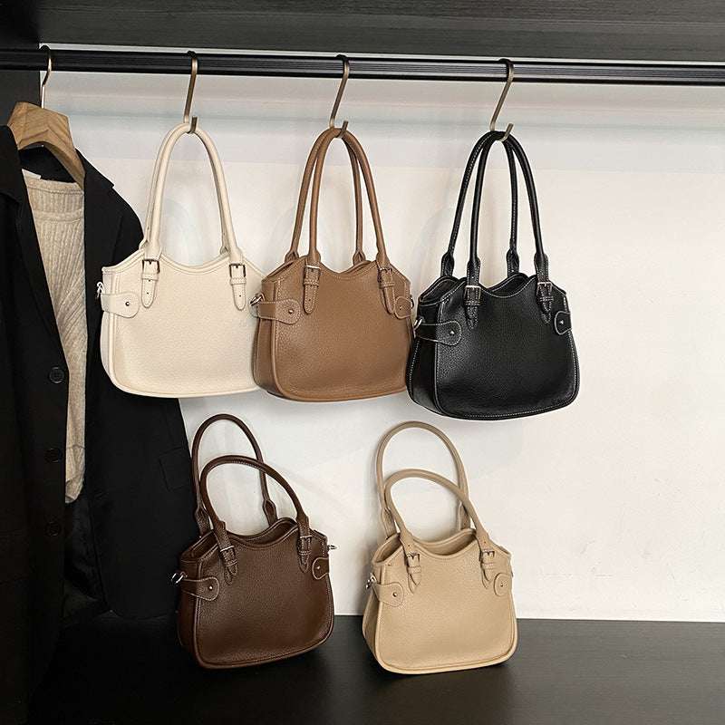 All-match PU leather handbag with adjustable strap and structured shape for travel and casual wear