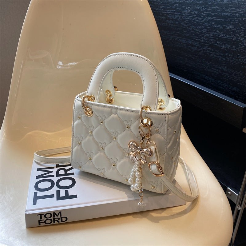 Stylish diamond embroidery polyester shoulder bag featuring intricate threadwork and a chic lightweight design