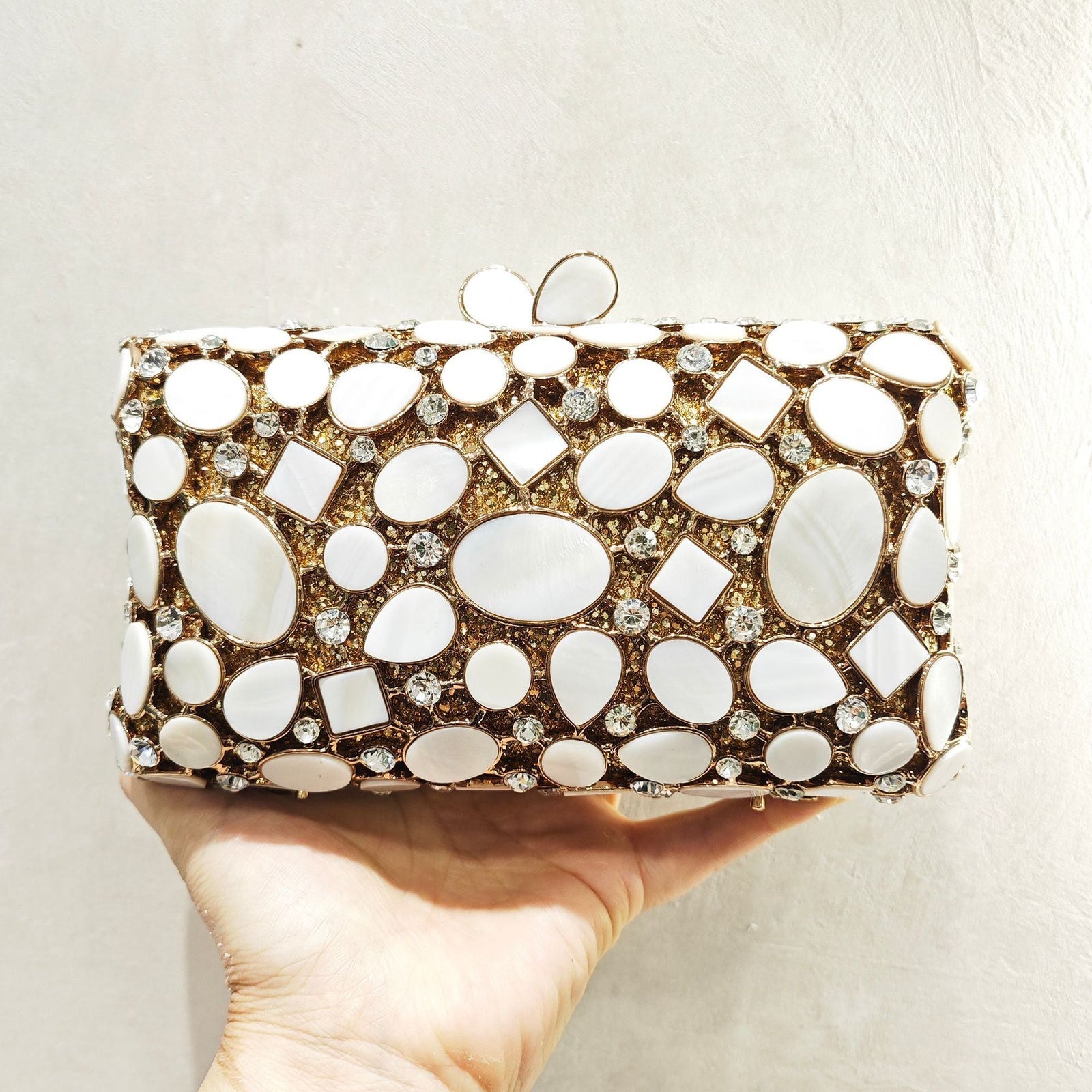 Gold shell clutch handbag embellished with full diamond crystal detailing