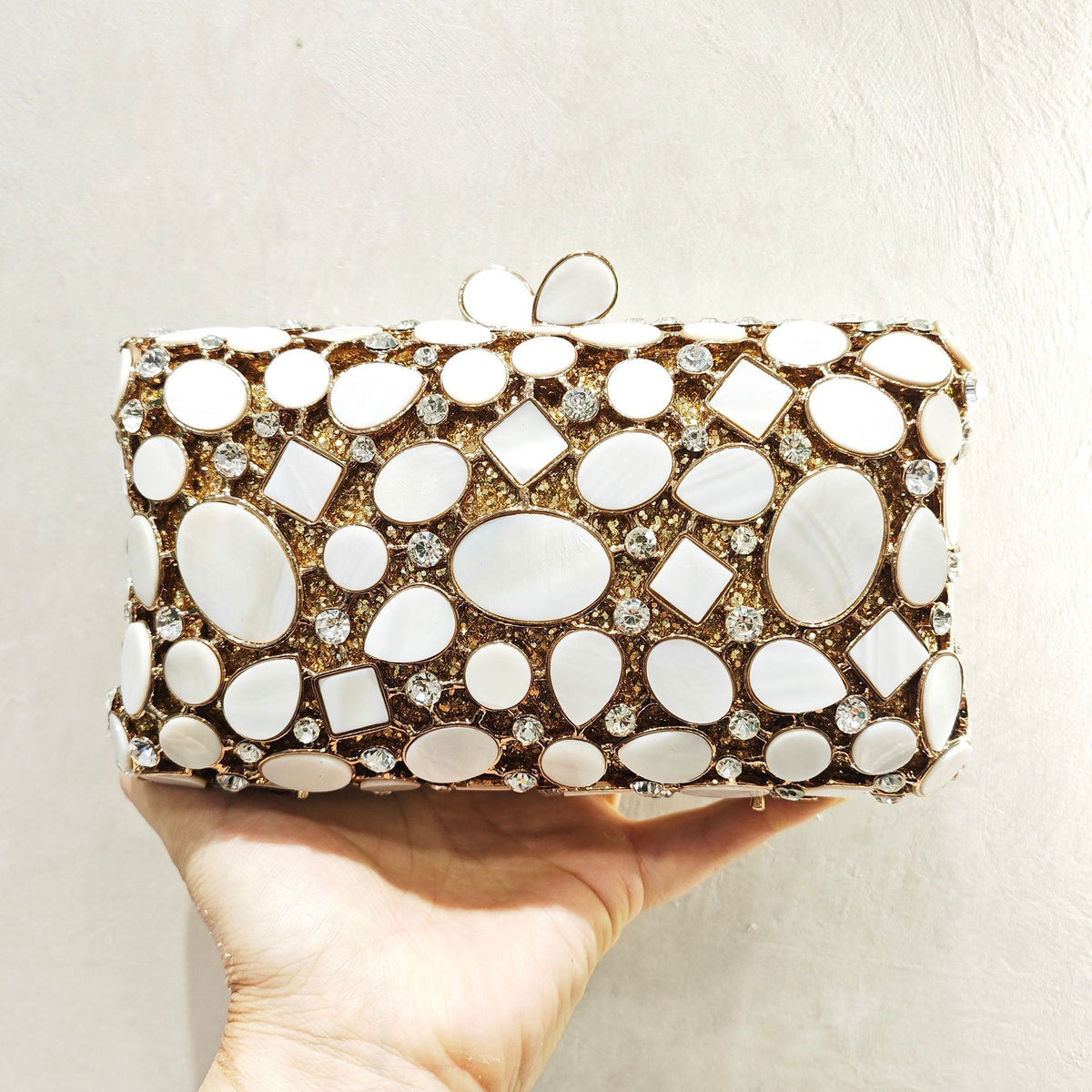 Gold shell clutch handbag embellished with full diamond crystal detailing